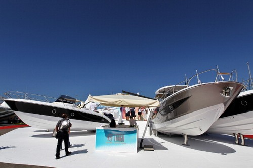 Visitors watch motorboats displayed in C